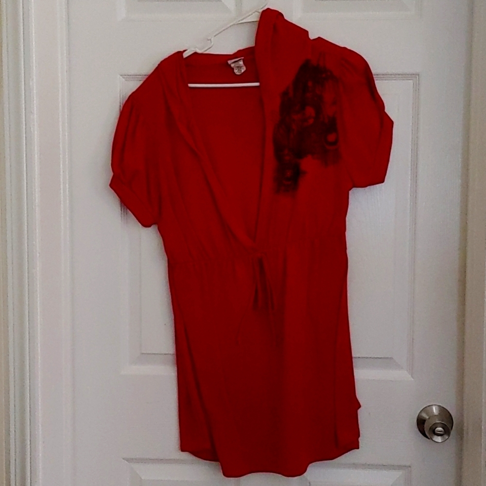 Women's red top with black design